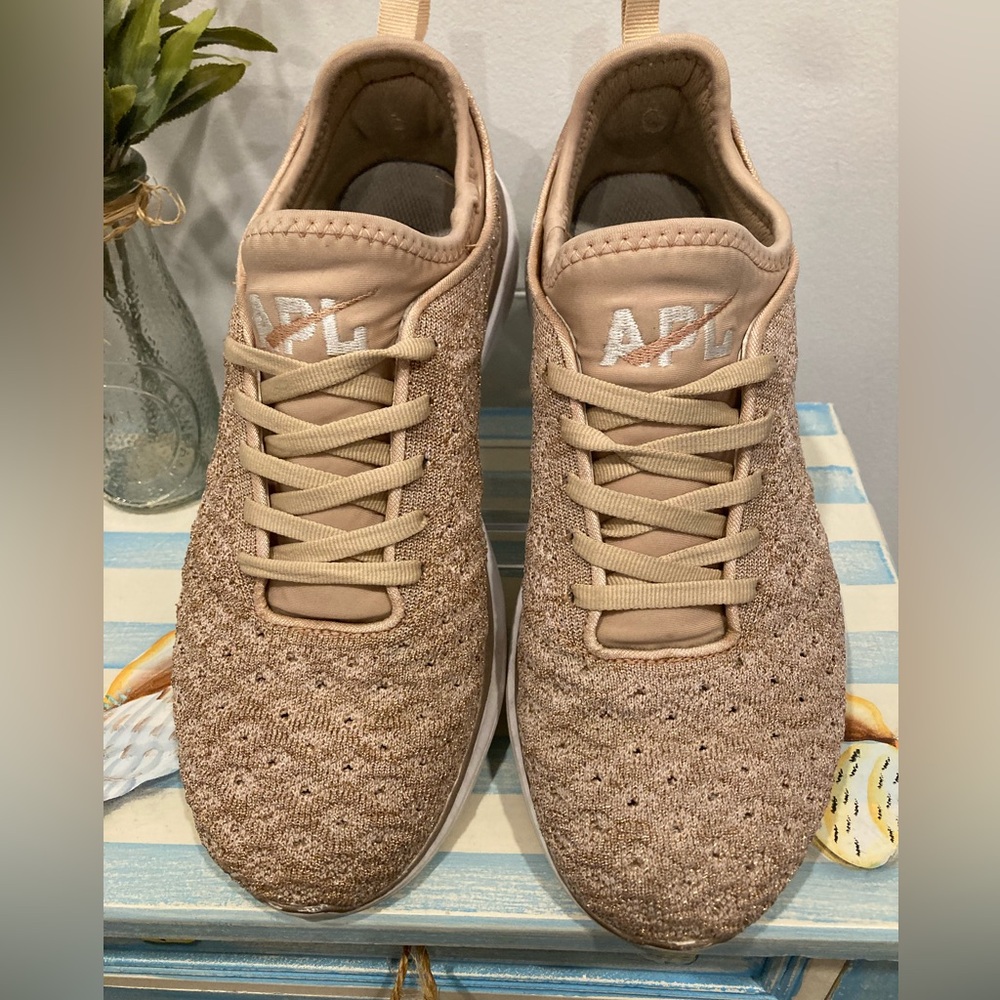 APL Techloom Phantom sneaker in a rose gold 8.5